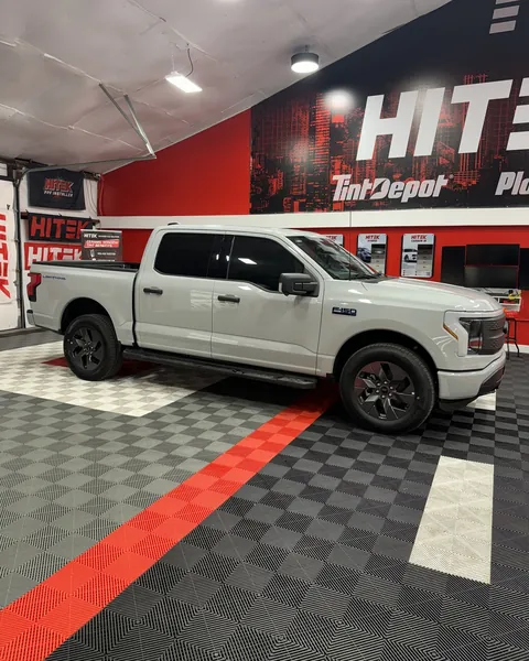 Gray Ford F-150 Lightning, side view, with ceramic window tint