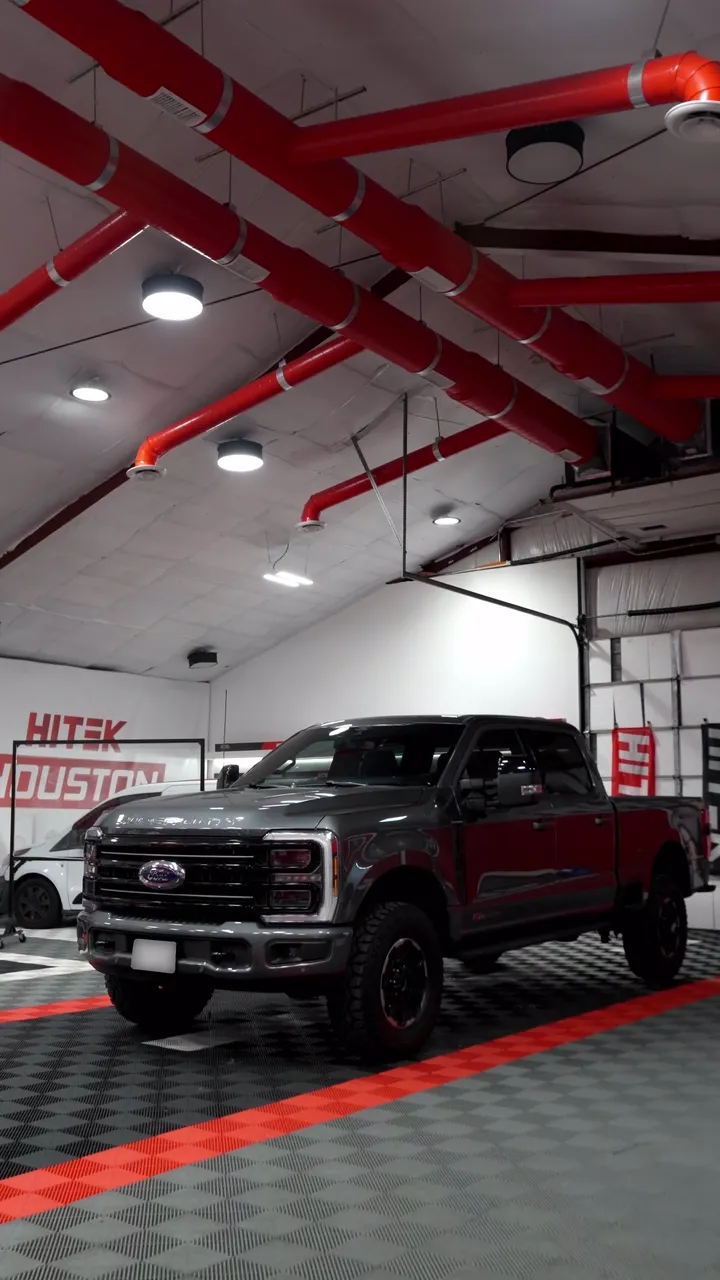 Gray Ford Super Duty crew cab with ceramic window tint in the Texas Tinted shop