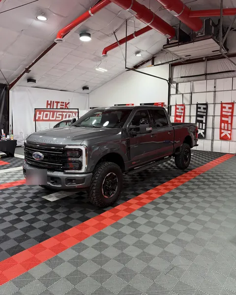 Gray Ford Super Duty crew cab with ceramic window tint