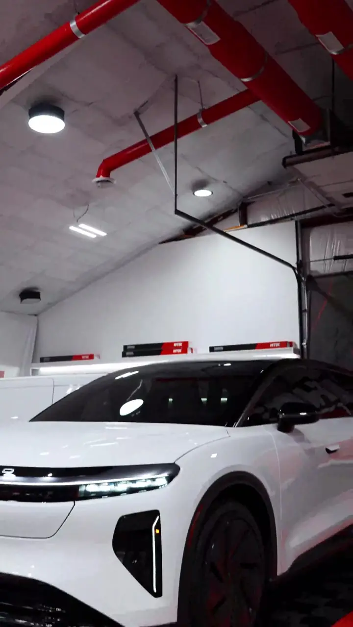 White Lucid Gravity SUV with ceramic window tint in the Texas Tinted shop in Houston