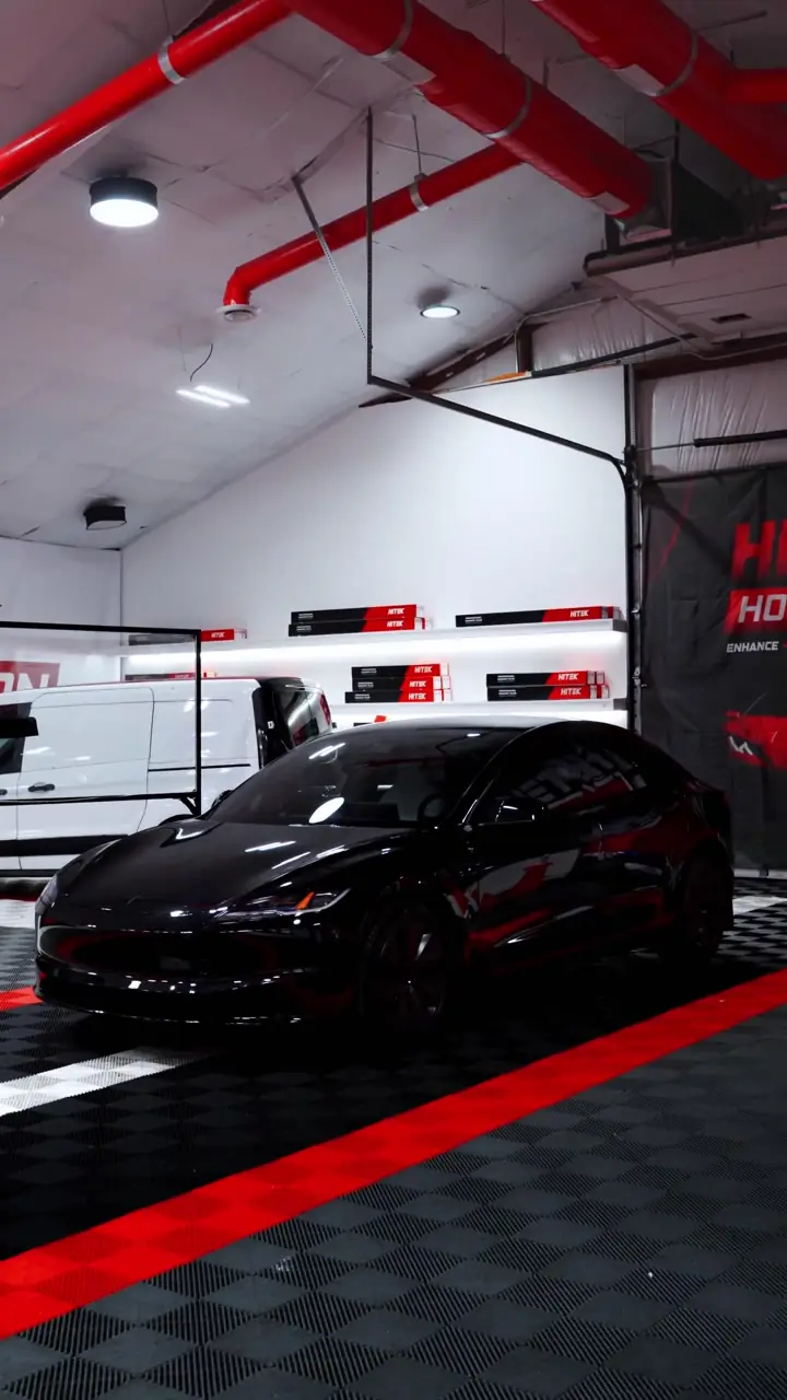Black Tesla Model 3 with ceramic window tint in the Texas Tinted shop in Houston