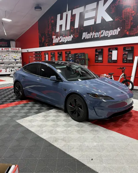 Blue Tesla Model 3 Performance in the shop for ceramic window tint
