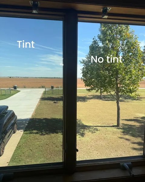 Two window panes side by side, labeled Tint and No tint: the filmed pane looks darker and calmer than the bare pane
